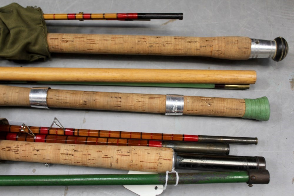 Five fishing rods including Milbro fibreglass and cane, together with