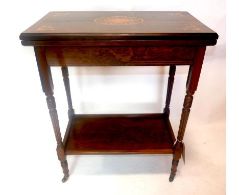 A late Victorian rosewood and satinwood inlaid foldover top card table. H.73 W.69 D.35cm 