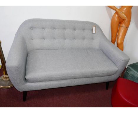 A mid century style button back sofa 