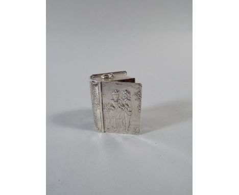 A Novelty Continental White Metal Snuff Box in the form of a Book. Front and Verso with Embossed Decoration depicting Lovers 