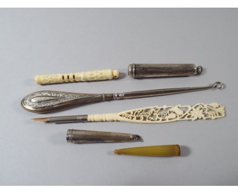 Two Silver Cases for Cheroot Holders, an Ivory Pen 'Ada Leech 1914-1917'. An Ivory Stanhope Needle Case (Missing View) A Horn