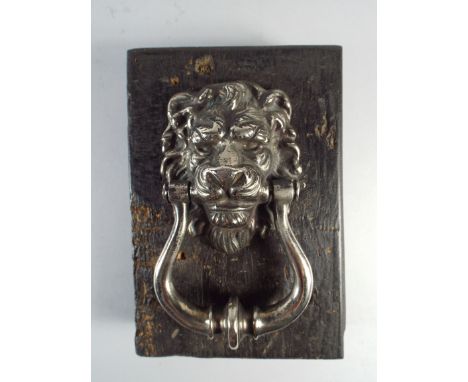 A 19th Century Nickel Plated Door Knocker with a Lions Mask. 10x16cm