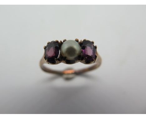 A 10ct gold amethyst and pearl ring, size R, weight approx 2.2 grams - stamped 10k, condition - some discolouration to shank 