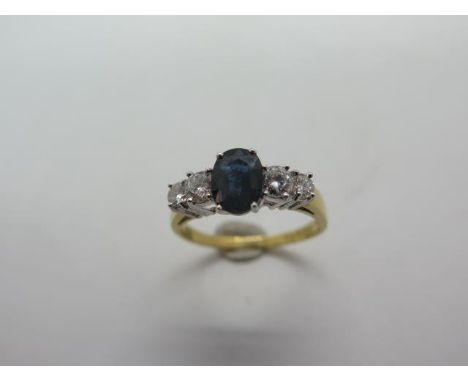 An 18ct hallmarked gold sapphire and diamond ring, diamond weight approx .55pts, VS2  - sapphire weight approx 1.75cts, ring 