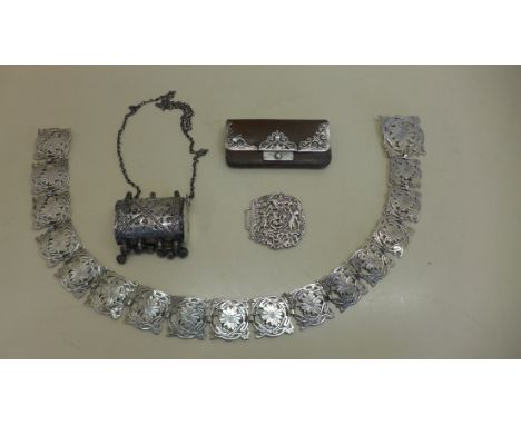 A silver mounted Victorian leather coin/stamp purse, London 1900 - A silver ornate belt buckle, Birmingham 1894 - missing cat