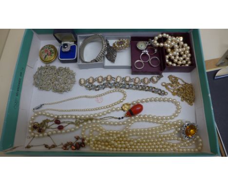 A collection of vintage costume and silver jewellery to include rings, necklaces, nurses buckle etc 