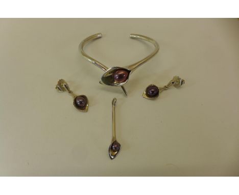 A matching suite of silver jewellery, consisting of bangle, earrings and pendant of Lilly form, all set with coloured pearls,
