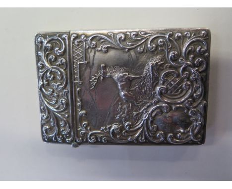 A good quality silver visiting card case featuring a stag and hinds with mountains in the background with repousse work front