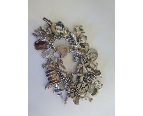 A silver charm bracelet with Georg Jensen lock, approx 86 grams 