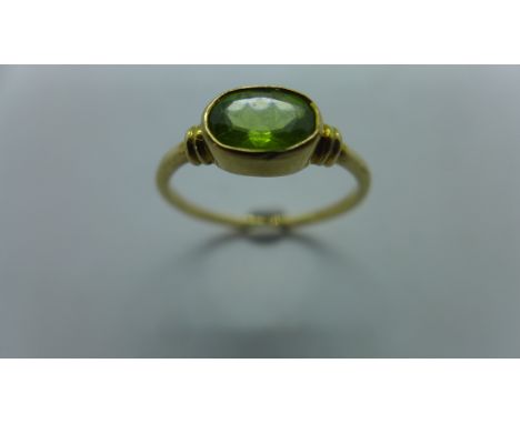 A 9ct gold peridot ring, the collet set stone oval in shape, approx 7x5mm, shank hallmarked, size L to  41/2 - light wear, sm