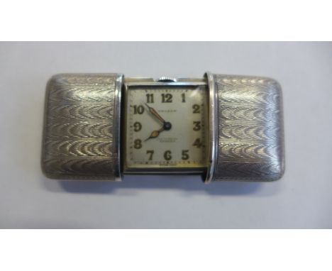 A silver 935 purse watch by Morado, in running order, generally good, 5x3.5cm closed 