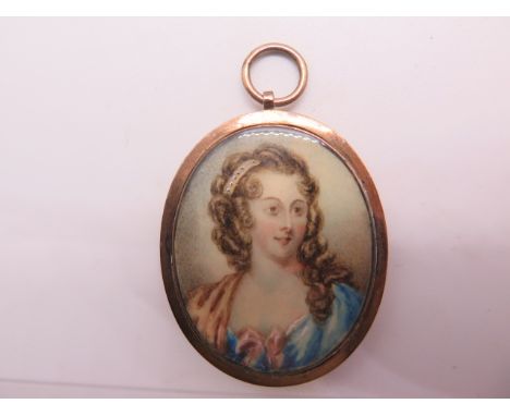 An antique gold portrait locket, probably late Georgian/early Victorian with a watercolour on ivory portrait of a young woman