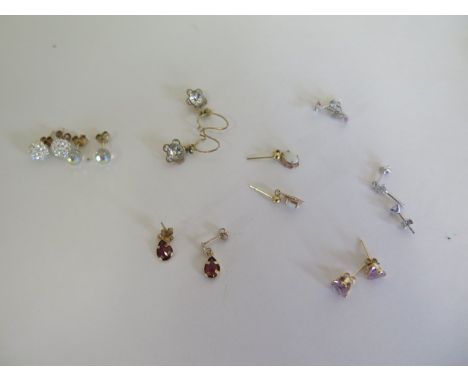 Seven pairs of 9ct stone set earrings including opals, amethyst etc 