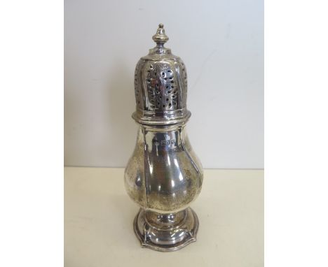 A silver shaker, 22cm tall, London 1911/12 - maker GH, approx 9.6 troy oz, minor bending to knop otherwise good 