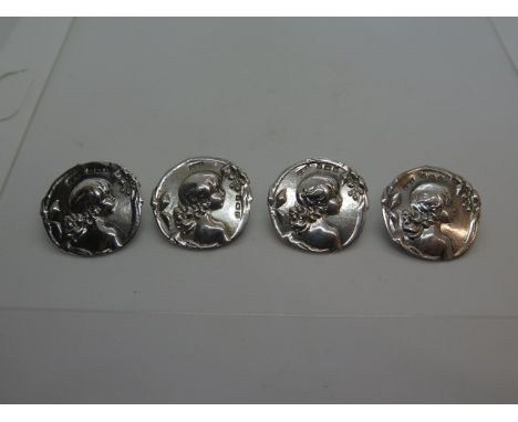 A set of four silver Art Nouveau by Samuel M Levi, Birmingham 1901 - side portrait of a young female child, diameter approx 3