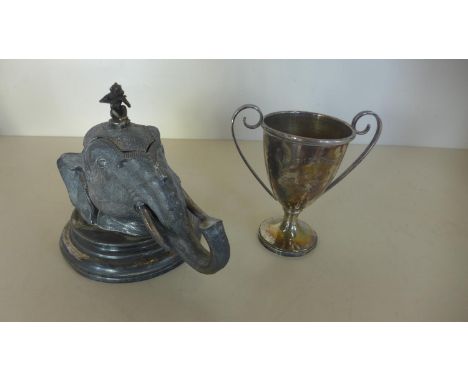 A silver plated desk inkwell in a the form of an elephants had with a monkey playing a pipe, 14cm tall and a small silver tro