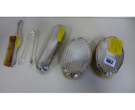 A pair of silver backed brushes by Henry Clifford Davis 1919, a single brush with matching comb back Sheffield 1922 - and a p
