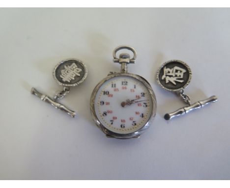 A pair of Tackhing Hong Kong silver cufflinks, and a silver pocket watch, not working 