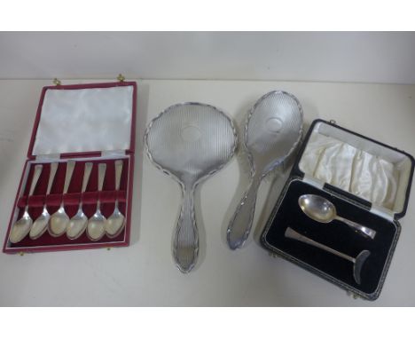 A boxed set of silver teaspoons, a silver spoon and pusher and a silver backed brush and mirror - weighable silver approx 3.4