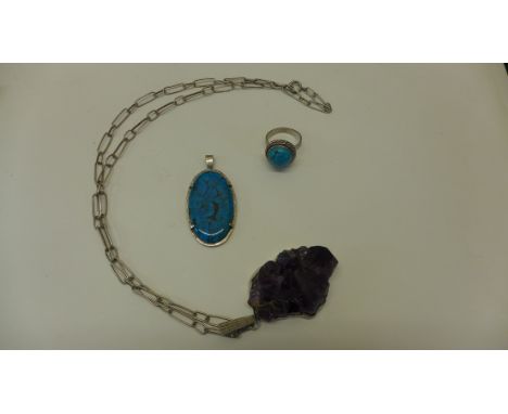 A turquoise ring and pendant and an amethyst pendant on chain, all test as silver 