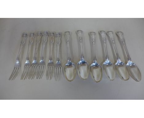 A good matched set of six Georgian silver dessert forks and six dessert spoons in Kings pattern, well cast and mostly clear h