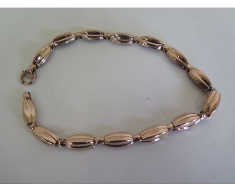 An unusual silver gilt necklace made up of textured tubular links, 48cm long 