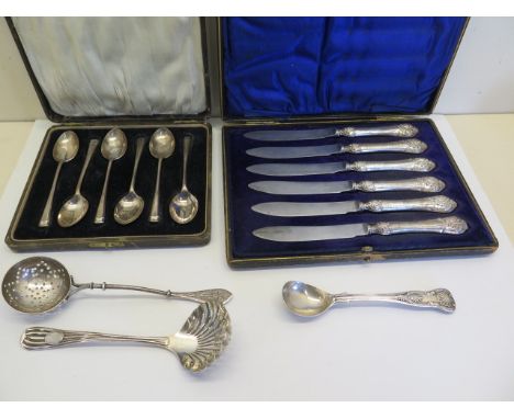 A cased set of six silver teaspoons set of six filled handle cake/fruit knives, Victorian silver sifter and preserve spoon an
