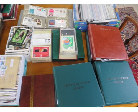 A collection of first day covers and postcards in thirteen albums and loose 