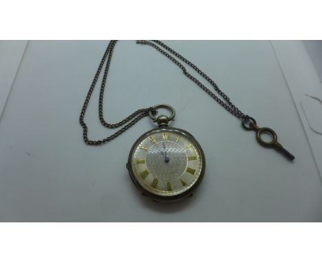 A silver cased fob/pocket watch on chain, the watch has a silvered engraved dial with gilt Roman numerals, finely engraved ba