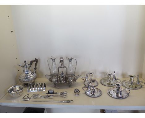 A good collection of silver plate including a good quality cruet set, five night sticks, toast rack etc, some wear to plate 