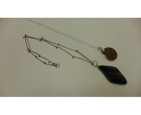 An amonite pendant on silver chain and a silver mounted labrodite pendant on silver chain 