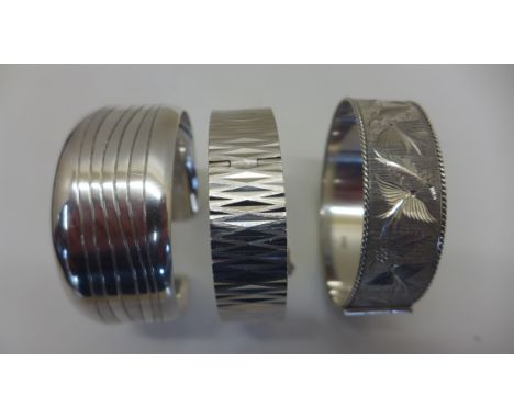 Three silver bangles, approx 89 grams 