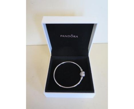 A Pandora silver sparkling heart bracelet, boxed, in good condition 