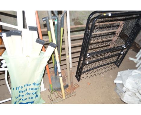 A quantity of long handled garden tools 