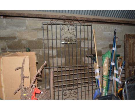 A wrought iron garden gate 