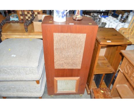 A teak floor standing speaker