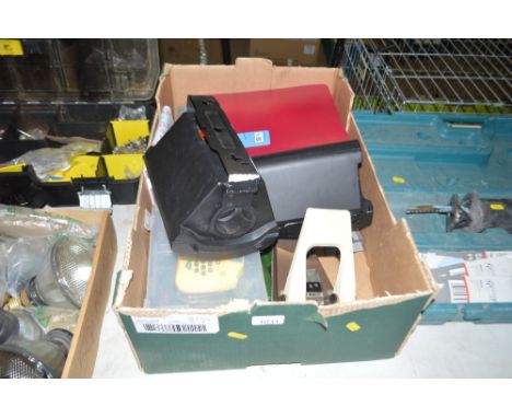 A box containing various stationary items; a hole punch; mantle clock etc