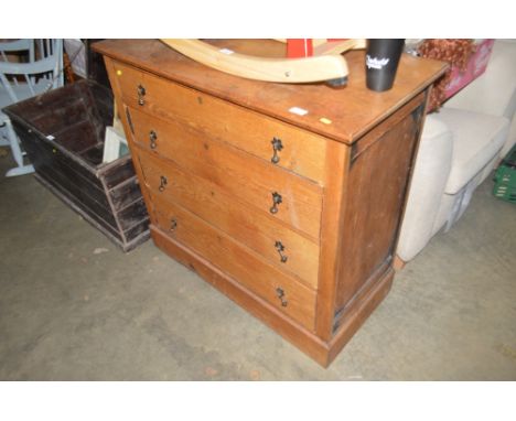 A light oak chest fitted four long drawers