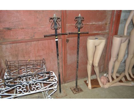 A pair of wrought iron metal light holders 