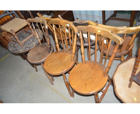 A set of six elm seated stick back kitchen chairs