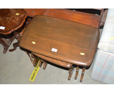 A nest of three Ercol occasional tables