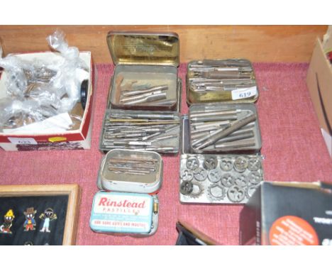 Seven tins of various engineering tools