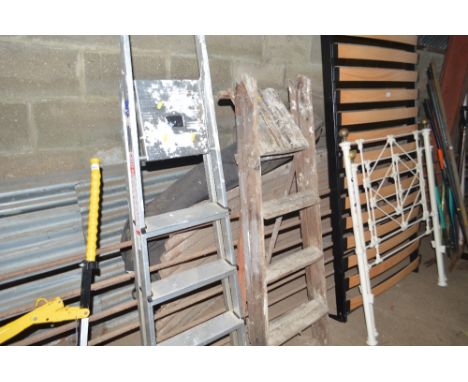An aluminium step ladder; and a wooden step ladder