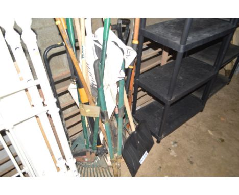 A quantity of long handled garden tools 