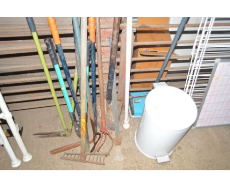 A quantity of long handled garden tools; a pedal bin etc.