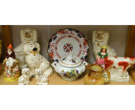 A pair of Victorian Staffordshire mantel dogs; another pair smaller; a single dog; a Victorian Staffordshire flatback milkmai