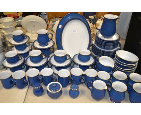 A comprehensive Denby Colonial Blue dinner and tea service, comprising serving dishes, plates, mugs, cups and saucers, dinner