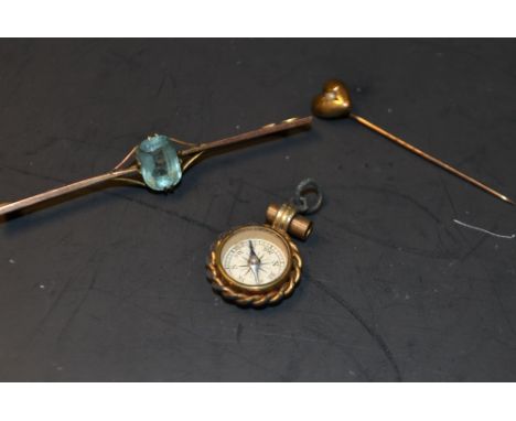 A 9ct gold and aquamarine bar brooch, a 9ct gold and seed pearl pin, compass pendant (3)