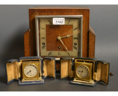 An oak cased Garrard mantle clock; a brass Zenith travel clock in case; another; similar (3)