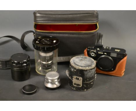 A Leica CL camera body, a Minolata to Leica adaptor, A Leitz Elmar 9cm F1.4 lens, a FED F3.5 50mm lens; a Minolta super Rokko